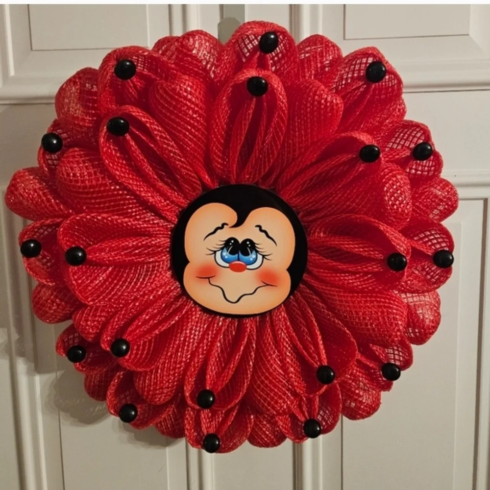 Red Decorative Floral Wreath with Smiling Face Center